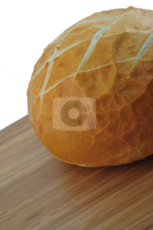 To use this stock image in your creative project, please select the size you need over to the right and click the "Add to Cart" button.
Your downloaded image will come with the Cutcaster watermark removed so don’t worry about the watermark you see on this page. Fresh Sourdough stock photo, Round loaf of fresh sourdough bread on a cutting board by Lynn Bendickson