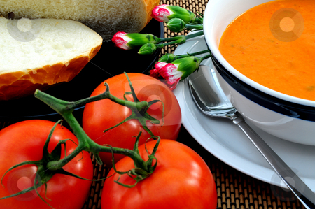 To use this stock image in your creative project, please select the size you need over to the right and click the "Add to Cart" button.
Your downloaded image will come with the Cutcaster watermark removed so don’t worry about the watermark you see on this page. Tomato Soup stock photo, Hot Tomato soup in a bowl with bread on the side by Lynn Bendickson
