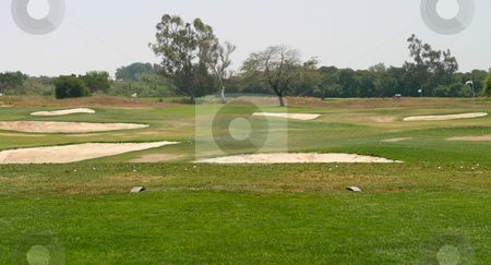 To use this stock image in your creative project, please select the size you need over to the right and click the "Add to Cart" button.
Your downloaded image will come with the Cutcaster watermark removed so don’t worry about the watermark you see on this page. Golf stock photo, Golf driving range or green fairway with bunkers by Henrik Lehnerer