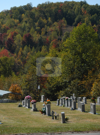 To use this stock image in your creative project, please select the size you need over to the right and click the "Add to Cart" button.
Your downloaded image will come with the Cutcaster watermark removed so don’t worry about the watermark you see on this page. Mountain graves stock photo, A cemetary near a small mountain by Tim Markley