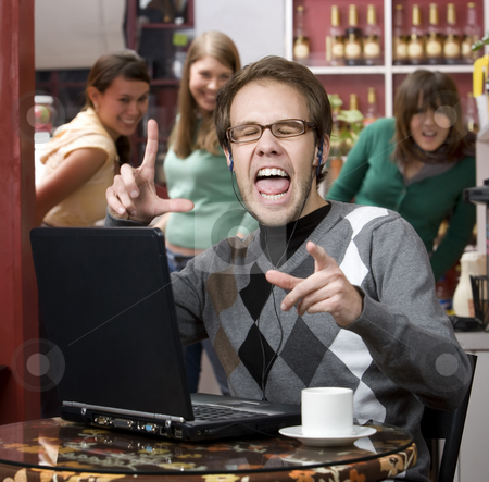 To use this stock image in your creative project, please select the size you need over to the right and click the "Add to Cart" button.
Your downloaded image will come with the Cutcaster watermark removed so don’t worry about the watermark you see on this page. Obnoxious young man singing loudly stock photo, Obnoxious young man singing loudly in a coffee house by Scott Griessel