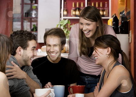 To use this stock image in your creative project, please select the size you need over to the right and click the "Add to Cart" button.
Your downloaded image will come with the Cutcaster watermark removed so don’t worry about the watermark you see on this page. Friends in a Coffee House stock photo, Five young friends in a coffee house by Scott Griessel