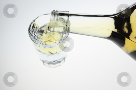 To use this stock image in your creative project, please select the size you need over to the right and click the "Add to Cart" button.
Your downloaded image will come with the Cutcaster watermark removed so don’t worry about the watermark you see on this page. Pouring a shot of tequila stock photo, Liquor poured into a shot glass by Bryan Mullennix