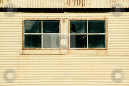 To use this stock image in your creative project, please select the size you need over to the right and click the "Add to Cart" button.
Your downloaded image will come with the Cutcaster watermark removed so don’t worry about the watermark you see on this page. Windows on a Mteal Building stock photo, Windows on an old currugated metal building. by Scott Griessel