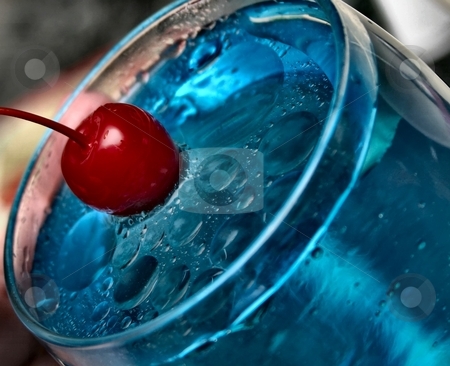 To use this stock image in your creative project, please select the size you need over to the right and click the "Add to Cart" button.
Your downloaded image will come with the Cutcaster watermark removed so don’t worry about the watermark you see on this page. Red Splash stock photo, A red cherry splashing into a glass of blue water by Karma Shuford