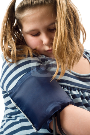 To use this stock image in your creative project, please select the size you need over to the right and click the "Add to Cart" button.
Your downloaded image will come with the Cutcaster watermark removed so don’t worry about the watermark you see on this page. Blood Pressure stock photo, A young girl look at a blood pressure cuff on her arm by Richard Nelson