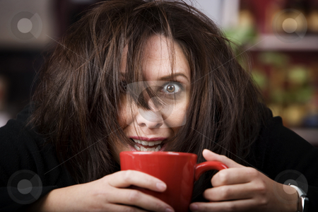 To use this stock image in your creative project, please select the size you need over to the right and click the "Add to Cart" button.
Your downloaded image will come with the Cutcaster watermark removed so don’t worry about the watermark you see on this page. Coffee-Crazed Woman stock photo, Half awake woman cradling a mug of coffee by Scott Griessel