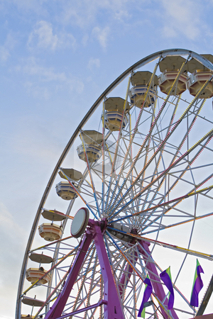 To use this stock image in your creative project, please select the size you need over to the right and click the "Add to Cart" button.
Your downloaded image will come with the Cutcaster watermark removed so don’t worry about the watermark you see on this page. Ferris-wheel at the fair stock photo, Ferris-wheel at the state fair, viewed as the sun begins to set. by Robert Ranson