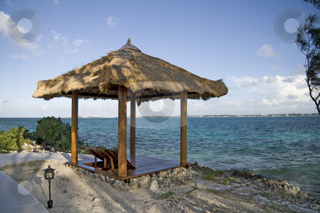 To use this stock image in your creative project, please select the size you need over to the right and click the "Add to Cart" button.
Your downloaded image will come with the Cutcaster watermark removed so don’t worry about the watermark you see on this page. Beach hut on tropical island stock photo, Beach hut on a small and beautiful tropical island. by Robert Ranson