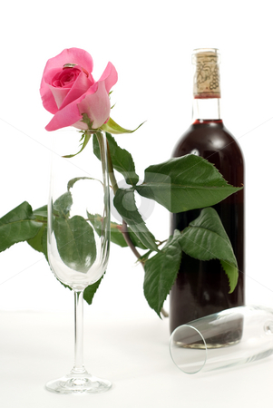 To use this stock image in your creative project, please select the size you need over to the right and click the "Add to Cart" button.
Your downloaded image will come with the Cutcaster watermark removed so don’t worry about the watermark you see on this page. Romantic Tabletop Setting stock photo, A tabletop setting with a bottle of wine, a rose and two empty wine glasses by Richard Nelson
