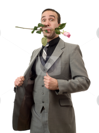 To use this stock image in your creative project, please select the size you need over to the right and click the "Add to Cart" button.
Your downloaded image will come with the Cutcaster watermark removed so don’t worry about the watermark you see on this page. Man With Rose In Mouth stock photo, A young man wearing a suit and holding a rose in his mouth, isolated against a white background by Richard Nelson