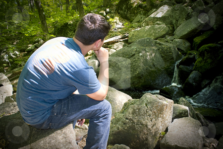 To use this stock image in your creative project, please select the size you need over to the right and click the "Add to Cart" button.
Your downloaded image will come with the Cutcaster watermark removed so don’t worry about the watermark you see on this page. Thinking by the Waterfall stock photo, A young man in deep thought while sitting on some rocks near a beautiful waterfall. by Todd Arena