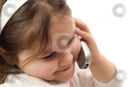 To use this stock image in your creative project, please select the size you need over to the right and click the "Add to Cart" button.
Your downloaded image will come with the Cutcaster watermark removed so don’t worry about the watermark you see on this page. Child Phone Conversation stock photo, A young girl having a phone conversation on a cellphone by Richard Nelson
