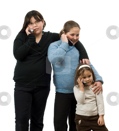 To use this stock image in your creative project, please select the size you need over to the right and click the "Add to Cart" button.
Your downloaded image will come with the Cutcaster watermark removed so don’t worry about the watermark you see on this page. Three Girls Talking On Cell Phones stock photo, Three young girls of different ages, talking on their cell phones, isolated against a white background by Richard Nelson