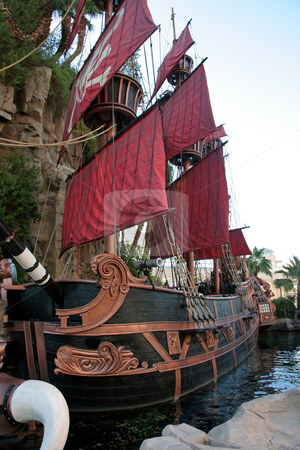 To use this stock image in your creative project, please select the size you need over to the right and click the "Add to Cart" button.
Your downloaded image will come with the Cutcaster watermark removed so don’t worry about the watermark you see on this page. Pirate Ship stock photo, A black and red pirate ship one water by Kevin Tietz