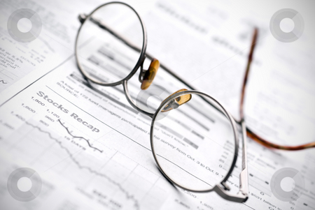 To use this stock image in your creative project, please select the size you need over to the right and click the "Add to Cart" button.
Your downloaded image will come with the Cutcaster watermark removed so don’t worry about the watermark you see on this page. Glasses on a newspaper stock report stock photo, Glasses on a newspaper stock report by Vince Clements