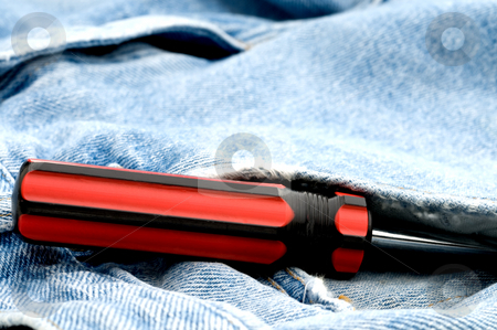 To use this stock image in your creative project, please select the size you need over to the right and click the "Add to Cart" button.
Your downloaded image will come with the Cutcaster watermark removed so don’t worry about the watermark you see on this page. Red and black screwdriver in jeans pocket stock photo, Red and black screwdriver in jeans pocket by Vince Clements