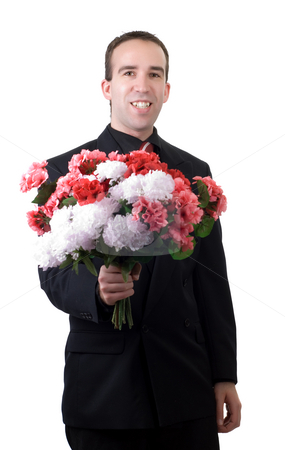 To use this stock image in your creative project, please select the size you need over to the right and click the "Add to Cart" button.
Your downloaded image will come with the Cutcaster watermark removed so don’t worry about the watermark you see on this page. Man With Flowers stock photo, A young man wearing a suit, holding a bouquet of flowers, isolated against a white background by Richard Nelson