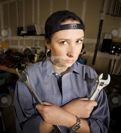 To use this stock image in your creative project, please select the size you need over to the right and click the "Add to Cart" button.
Your downloaded image will come with the Cutcaster watermark removed so don’t worry about the watermark you see on this page. Hispanic woman in a agarage stock photo, Hispanic woman in a garage with wrenches by Scott Griessel