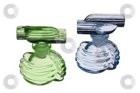 To use this stock image in your creative project, please select the size you need over to the right and click the "Add to Cart" button.
Your downloaded image will come with the Cutcaster watermark removed so don’t worry about the watermark you see on this page. Blue and green stock photo, A green and light blue antique perfume (scent) bottles. Glass with stoppers by Paul Phillips