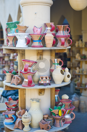 To use this stock image in your creative project, please select the size you need over to the right and click the "Add to Cart" button.
Your downloaded image will come with the Cutcaster watermark removed so don’t worry about the watermark you see on this page. Traditional Arabian market stock photo, Traditional Arabian market in Oman with various ceramic items on display, including incense burners and water pots. by Nicolaas Traut