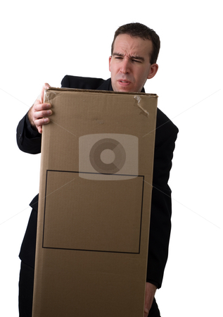 To use this stock image in your creative project, please select the size you need over to the right and click the "Add to Cart" button.
Your downloaded image will come with the Cutcaster watermark removed so don’t worry about the watermark you see on this page. Struggling Businessman stock photo, A young businessman struggling to lift a box with your text on it by Richard Nelson