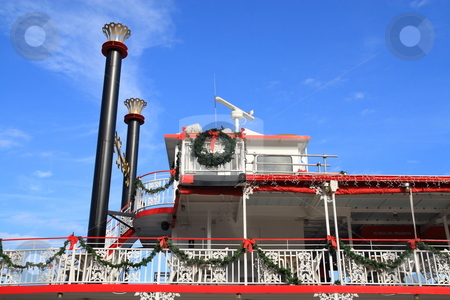 To use this stock image in your creative project, please select the size you need over to the right and click the "Add to Cart" button.
Your downloaded image will come with the Cutcaster watermark removed so don’t worry about the watermark you see on this page. Christmas Ferry stock photo, Ferry boat railings decroated with christmas ornaments by Jack Schiffer