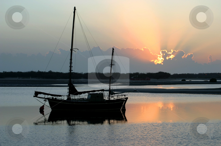 To use this stock image in your creative project, please select the size you need over to the right and click the "Add to Cart" button.
Your downloaded image will come with the Cutcaster watermark removed so don’t worry about the watermark you see on this page. Sunrise Ketch stock photo, Ancient old ketch moored peacefully at sunrise. by Brett Mulcahy