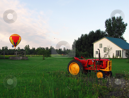 To use this stock image in your creative project, please select the size you need over to the right and click the "Add to Cart" button.
Your downloaded image will come with the Cutcaster watermark removed so don’t worry about the watermark you see on this page. Hot Air Balloons and Tractor stock photo, Hot Air Balloons over a field and an old tractor by Alain Turgeon