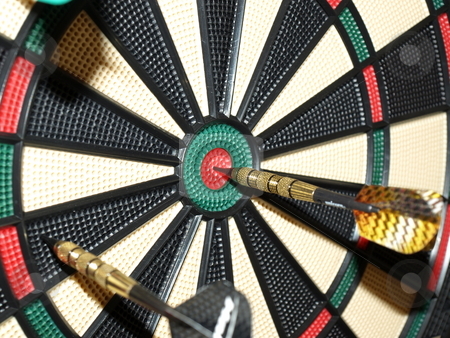 To use this stock image in your creative project, please select the size you need over to the right and click the "Add to Cart" button.
Your downloaded image will come with the Cutcaster watermark removed so don’t worry about the watermark you see on this page. On the mark stock photo, Darts thrown at the board with one bullseye by Tim Markley