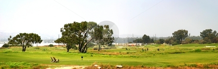 To use this stock image in your creative project, please select the size you need over to the right and click the "Add to Cart" button.
Your downloaded image will come with the Cutcaster watermark removed so don’t worry about the watermark you see on this page. Golf stock photo, Panoramic shot of a golf fairway near Ventura by Henrik Lehnerer