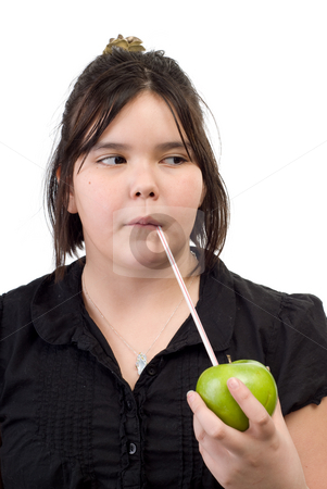 To use this stock image in your creative project, please select the size you need over to the right and click the "Add to Cart" button.
Your downloaded image will come with the Cutcaster watermark removed so don’t worry about the watermark you see on this page. Healthy Living stock photo, A young girl sucking on a straw that is sticking out of an apple, isolated against a white background by Richard Nelson