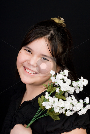 To use this stock image in your creative project, please select the size you need over to the right and click the "Add to Cart" button.
Your downloaded image will come with the Cutcaster watermark removed so don’t worry about the watermark you see on this page. Cute Child Portrait stock photo, Portrait of a cute girl holding some white flowers, shot against a dark background by Richard Nelson