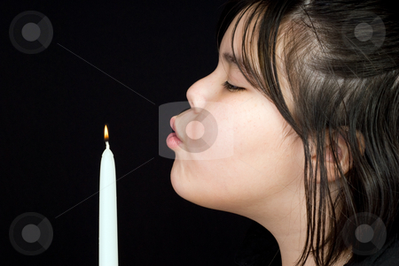 To use this stock image in your creative project, please select the size you need over to the right and click the "Add to Cart" button.
Your downloaded image will come with the Cutcaster watermark removed so don’t worry about the watermark you see on this page. Extinguish stock photo, Closeup of a young girl blowing out a candle's flame, shot against a dark background by Richard Nelson