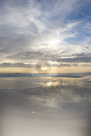 To use this stock image in your creative project, please select the size you need over to the right and click the "Add to Cart" button.
Your downloaded image will come with the Cutcaster watermark removed so don’t worry about the watermark you see on this page. Beach Surf 2 stock photo, The setting sun reflects off the water as the surf flows in and the clouds glow on the horizon by A Cotton Photo