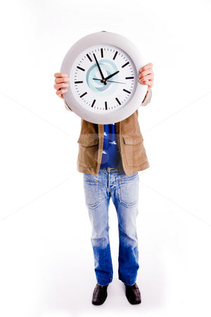 To use this stock image in your creative project, please select the size you need over to the right and click the "Add to Cart" button.
Your downloaded image will come with the Cutcaster watermark removed so don’t worry about the watermark you see on this page. What time is it - clock stock photo, Front view of young man hiding his face with watch on an isolated background by Imagery Majestic