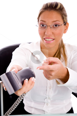 To use this stock image in your creative project, please select the size you need over to the right and click the "Add to Cart" button.
Your downloaded image will come with the Cutcaster watermark removed so don’t worry about the watermark you see on this page. Smiling executive pointing at phone stock photo, Front view of smiling executive pointing at phone with white background by Imagery Majestic