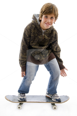 To use this stock image in your creative project, please select the size you need over to the right and click the "Add to Cart" button.
Your downloaded image will come with the Cutcaster watermark removed so don’t worry about the watermark you see on this page. Front view of smiling child standing on skateboard stock photo, Front view of smiling child standing on skateboard on an isolated background by Imagery Majestic