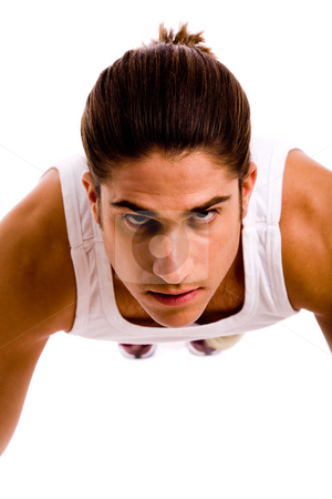 To use this stock image in your creative project, please select the size you need over to the right and click the "Add to Cart" button.
Your downloaded image will come with the Cutcaster watermark removed so don’t worry about the watermark you see on this page. Front view of young man doing pushups stock photo, Front view of young man doing pushups against white background by Imagery Majestic