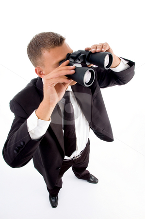 To use this stock image in your creative project, please select the size you need over to the right and click the "Add to Cart" button.
Your downloaded image will come with the Cutcaster watermark removed so don’t worry about the watermark you see on this page. Young accountant looking through binoculars stock photo, Young accountant looking through binoculars on an isolated white background by Imagery Majestic