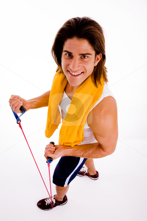 To use this stock image in your creative project, please select the size you need over to the right and click the "Add to Cart" button.
Your downloaded image will come with the Cutcaster watermark removed so don’t worry about the watermark you see on this page. High angle view of man exercising with rope stock photo, High angle view of man exercising with rope with white background by Imagery Majestic