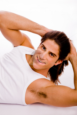 To use this stock image in your creative project, please select the size you need over to the right and click the "Add to Cart" button.
Your downloaded image will come with the Cutcaster watermark removed so don’t worry about the watermark you see on this page. Workout session stock photo, Side view of smiling exercising male on an isolated white background by Imagery Majestic