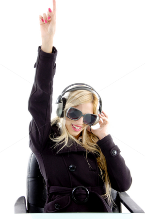 To use this stock image in your creative project, please select the size you need over to the right and click the "Add to Cart" button.
Your downloaded image will come with the Cutcaster watermark removed so don’t worry about the watermark you see on this page. Front view of pointing woman enjoying music stock photo, Close view of woman enjoying music with white background by Imagery Majestic