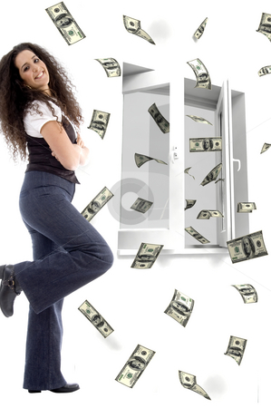 To use this stock image in your creative project, please select the size you need over to the right and click the "Add to Cart" button.
Your downloaded image will come with the Cutcaster watermark removed so don’t worry about the watermark you see on this page. Smiling young woman and flying dollars stock photo, Smiling young woman and three dimensional flying dollars notes out of a window by Imagery Majestic