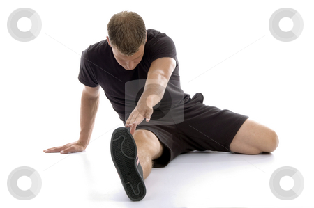 To use this stock image in your creative project, please select the size you need over to the right and click the "Add to Cart" button.
Your downloaded image will come with the Cutcaster watermark removed so don’t worry about the watermark you see on this page. Man stretching his legs stock photo, Man stretching his legs against white background by Imagery Majestic