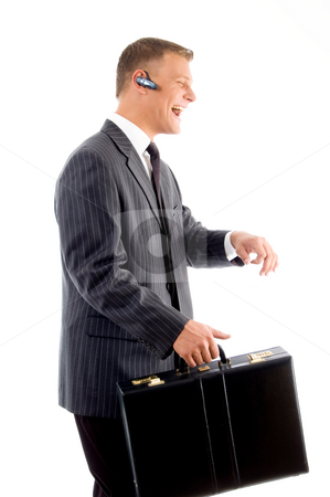 To use this stock image in your creative project, please select the size you need over to the right and click the "Add to Cart" button.
Your downloaded image will come with the Cutcaster watermark removed so don’t worry about the watermark you see on this page. Successful businessman smiling and holding office bag stock photo, Successful businessman smiling and holding office bag against white background by Imagery Majestic