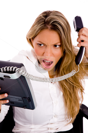 To use this stock image in your creative project, please select the size you need over to the right and click the "Add to Cart" button.
Your downloaded image will come with the Cutcaster watermark removed so don’t worry about the watermark you see on this page. Front view of angry woman holding phone stock photo, Front view of angry woman holding phone against white background by Imagery Majestic