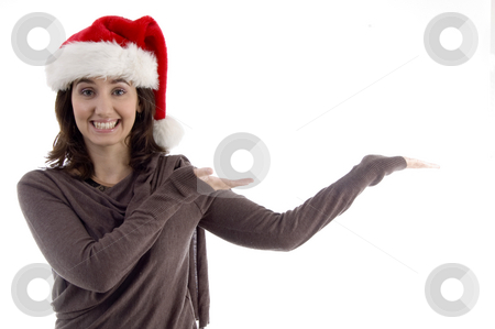 To use this stock image in your creative project, please select the size you need over to the right and click the "Add to Cart" button.
Your downloaded image will come with the Cutcaster watermark removed so don’t worry about the watermark you see on this page. Young female in christmas hat with open palms stock photo, Young female in christmas hat with open palms on an isolated white background by Imagery Majestic