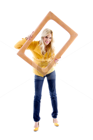 To use this stock image in your creative project, please select the size you need over to the right and click the "Add to Cart" button.
Your downloaded image will come with the Cutcaster watermark removed so don’t worry about the watermark you see on this page. Front view of smiling model posing with frame stock photo, Front view of smiling model posing with frame on an isolated white background by Imagery Majestic