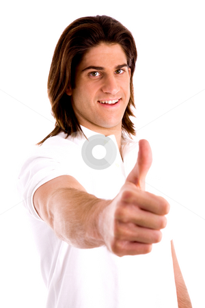 To use this stock image in your creative project, please select the size you need over to the right and click the "Add to Cart" button.
Your downloaded image will come with the Cutcaster watermark removed so don’t worry about the watermark you see on this page. Side view of model with thumbs up stock photo, Side view of model with thumbsup against white background by Imagery Majestic